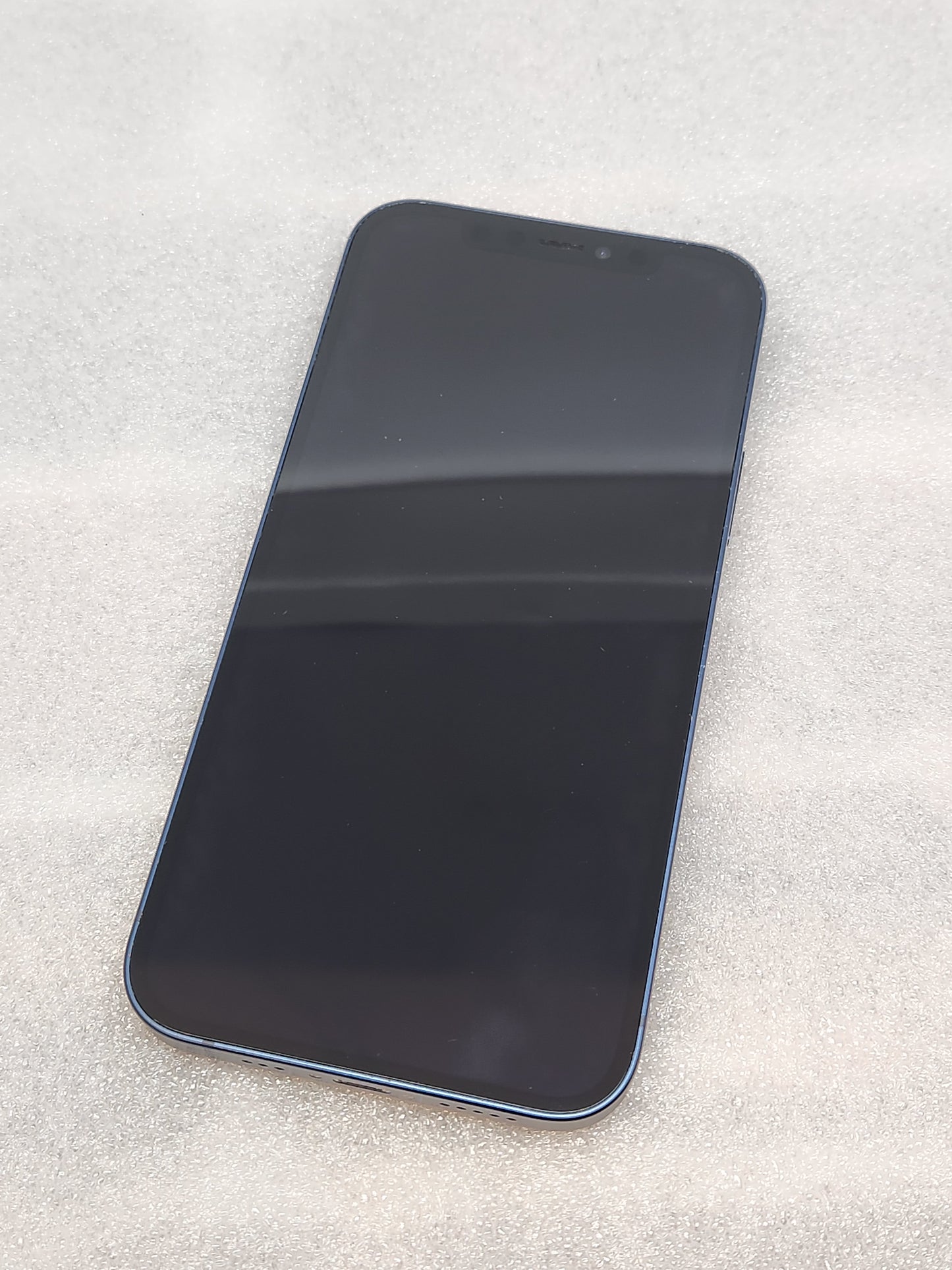 Refurbised iPhone 12. .blue. 64GB. unlocked. iOS 26. battery health 92%